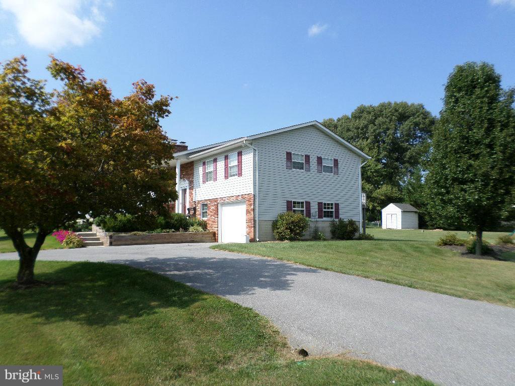 2520 Neudecker Road Westminster, MD 21157 - Photo 25 of 27 a front view of a house with a yard and trees