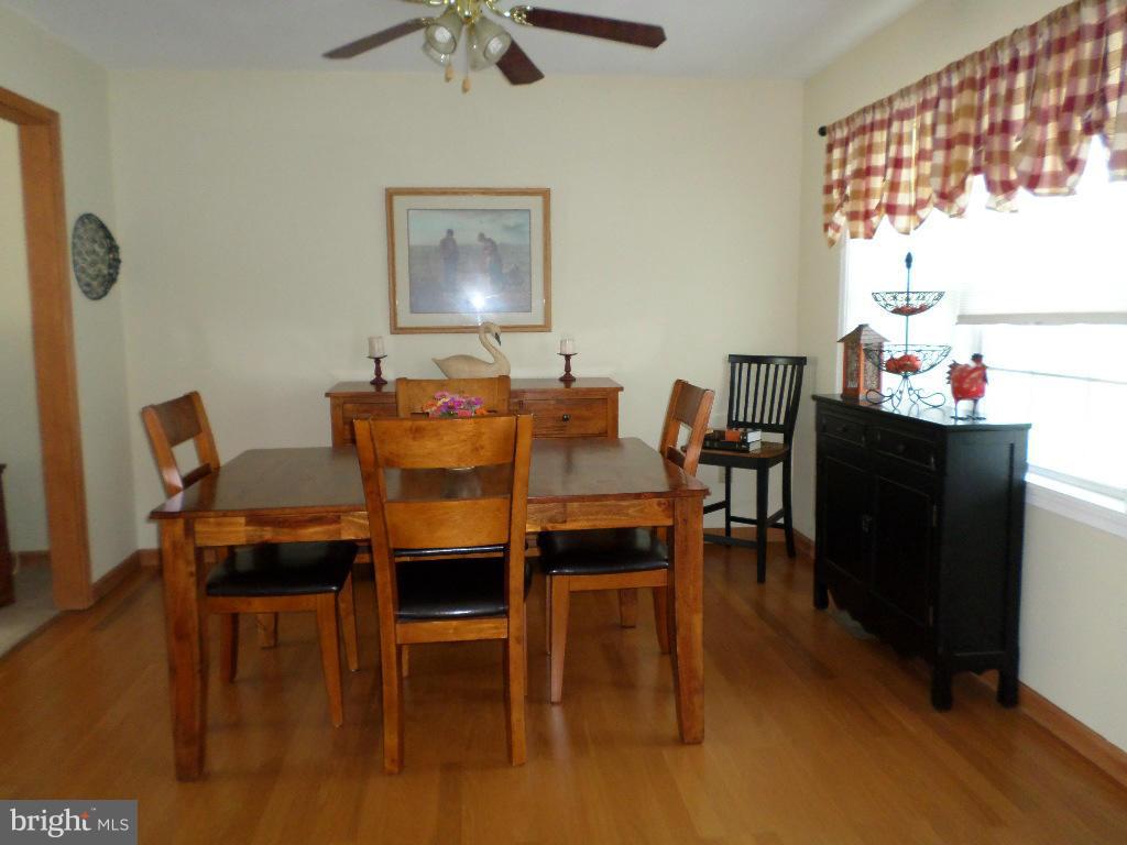 2520 Neudecker Road Westminster, MD 21157 - Photo 6 of 27 a view of a dining room with furniture and a chandelier