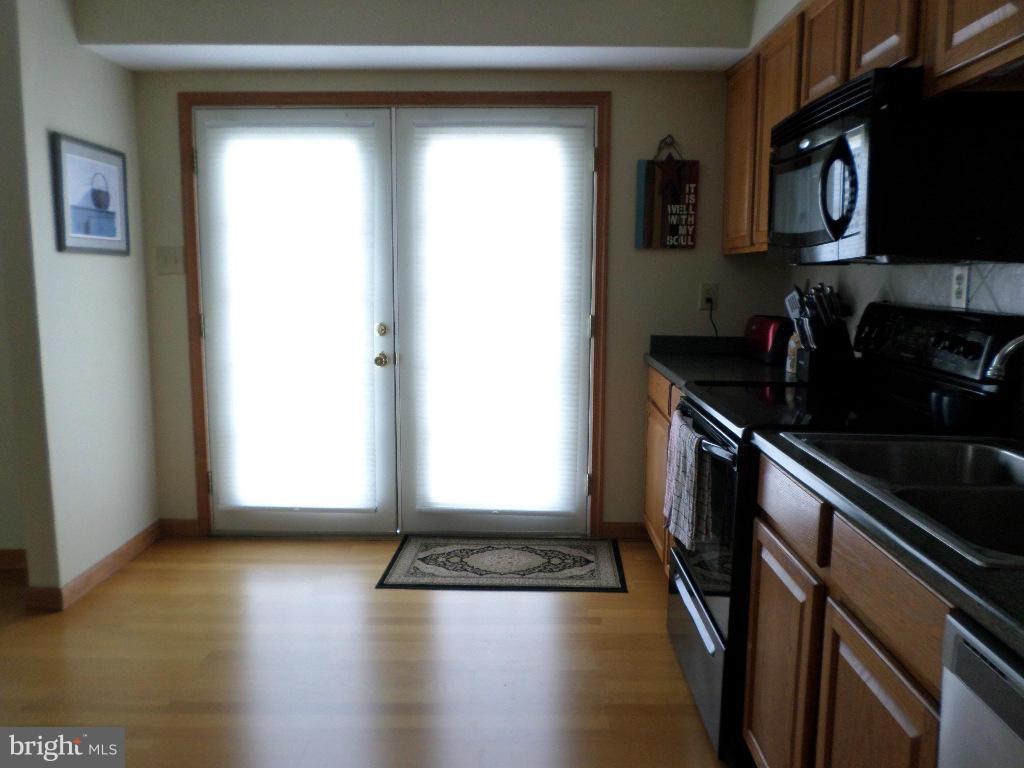 2520 Neudecker Road Westminster, MD 21157 - Photo 8 of 27 an empty room with wooden floor and a window
