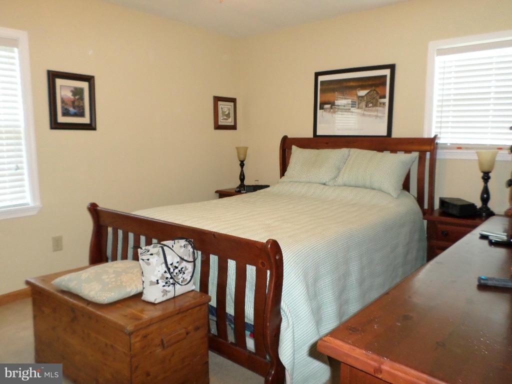 2520 Neudecker Road Westminster, MD 21157 - Photo 10 of 27 a bedroom with a bed and a table in it