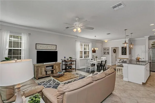 an aerial view of a houses with a swimming pool
