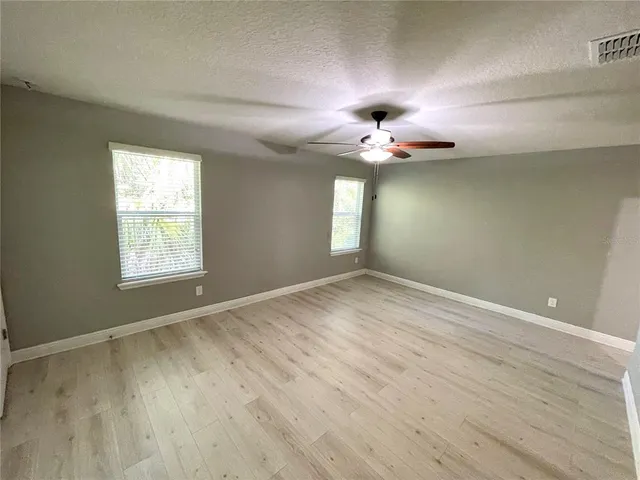 an aerial view of residential houses with outdoor space and swimming pool