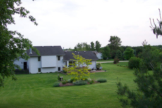 4234 Montclair Road Roscoe, IL 61073 - Photo 6 of 6 a view of house with a big yard