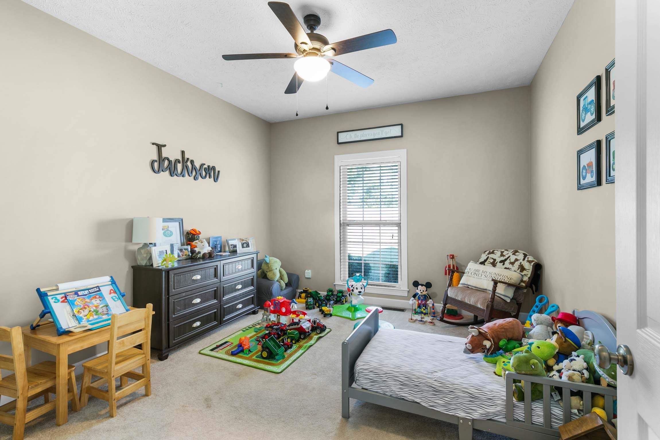 335 Booth Loop Henderson, TN 38340 - Photo 14 of 20 a bedroom with furniture and a gym equipment