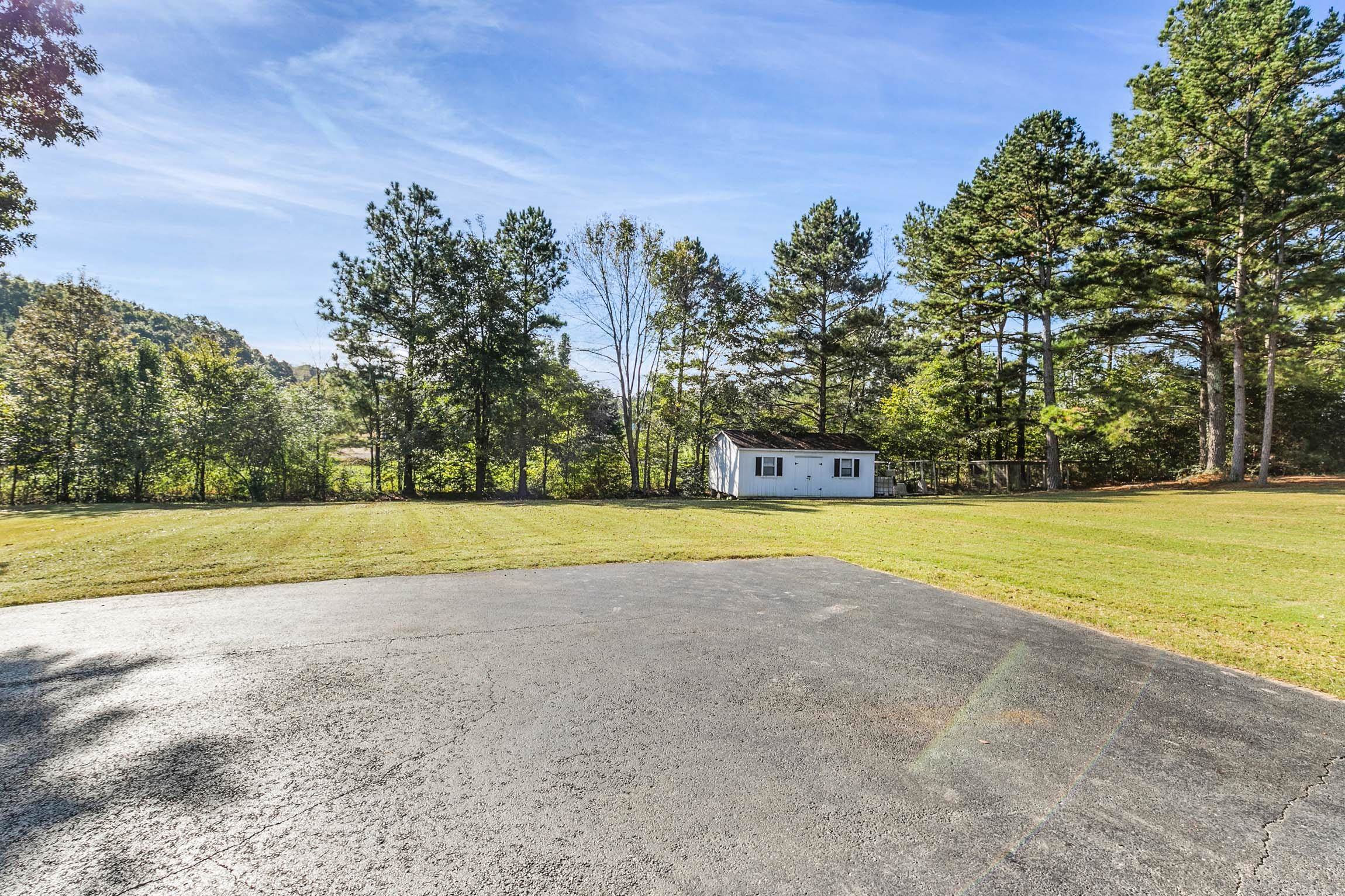 335 Booth Loop Henderson, TN 38340 - Photo 20 of 20 a view of swimming pool with trees in the background