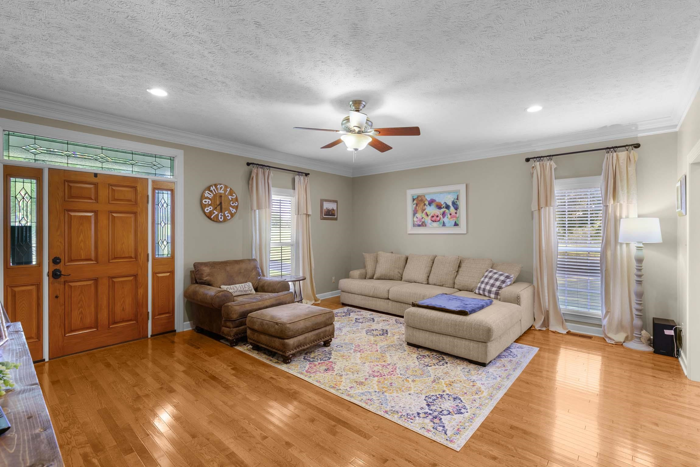 335 Booth Loop Henderson, TN 38340 - Photo 2 of 20 a living room with furniture and a chandelier
