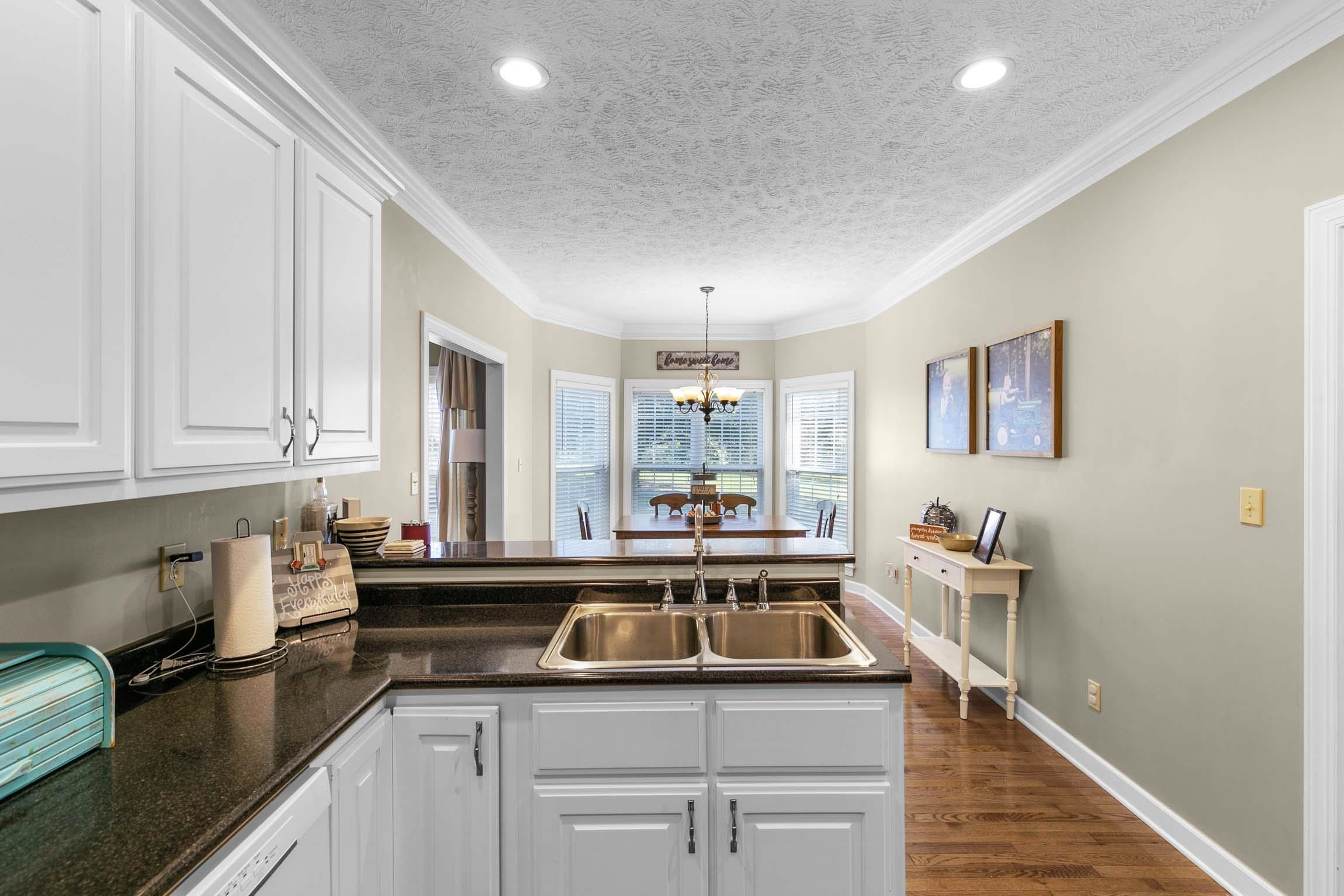 335 Booth Loop Henderson, TN 38340 - Photo 7 of 20 a kitchen with a sink and cabinets