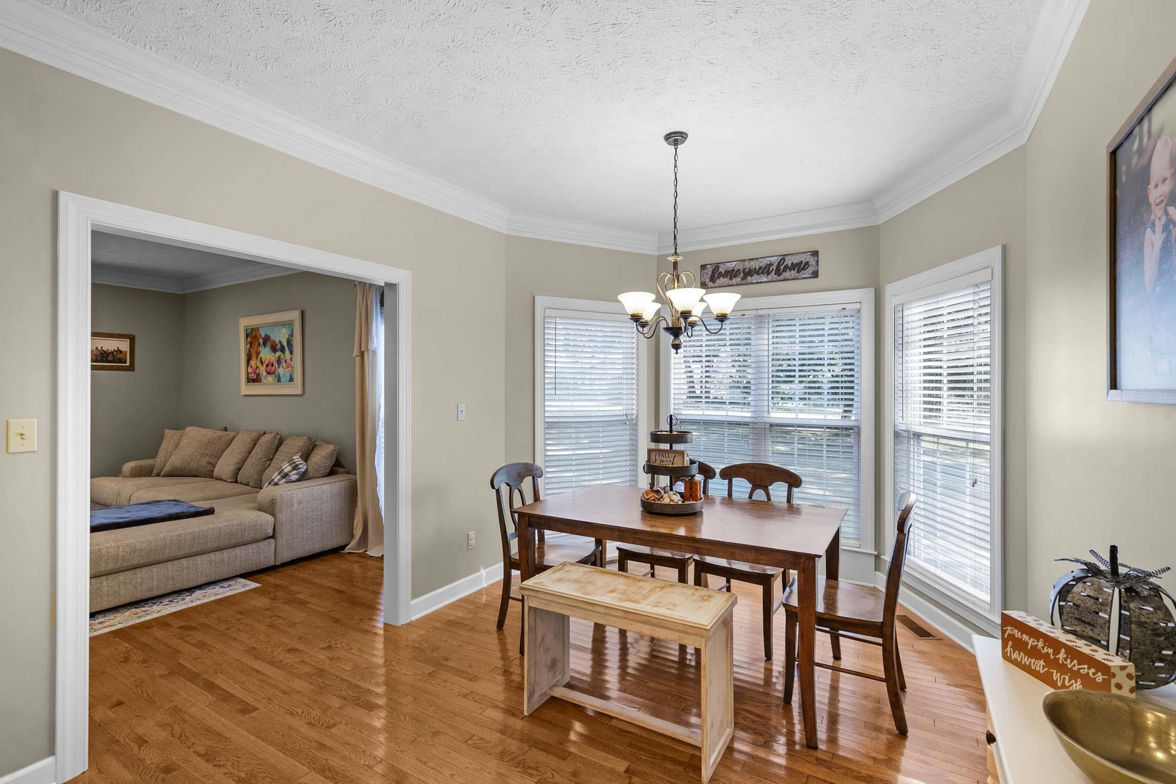 335 Booth Loop Henderson, TN 38340 - Photo 8 of 20 a view of a livingroom with furniture window and wooden floor