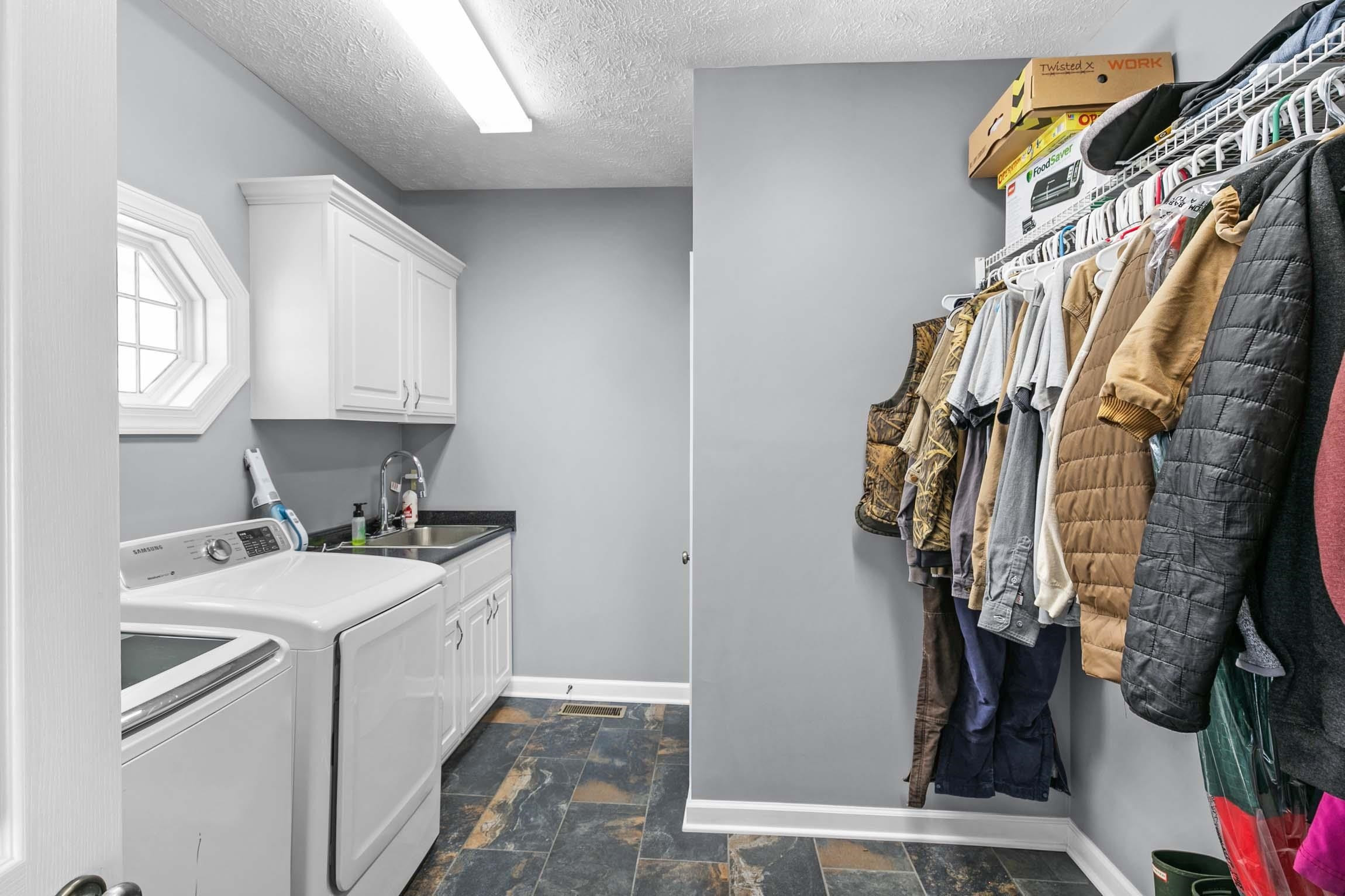 335 Booth Loop Henderson, TN 38340 - Photo 9 of 20 a view of walk in closet with clothes and shoes