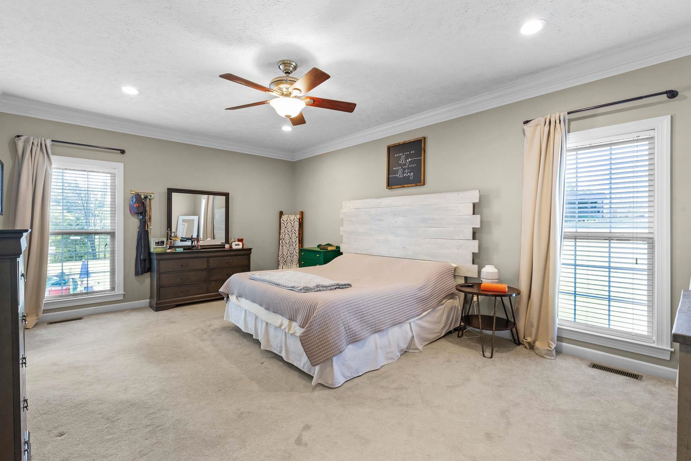 335 Booth Loop Henderson, TN 38340 - Photo 10 of 20 a spacious bedroom with a bed and a large window