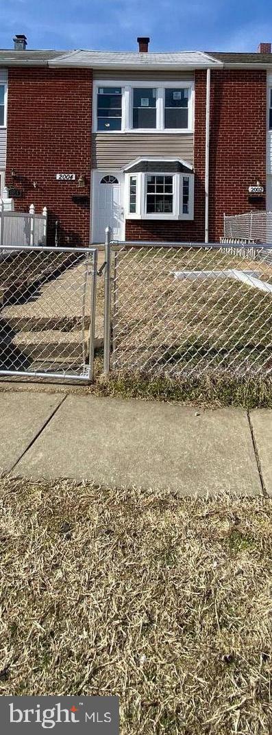 2004 Kelmore Road Baltimore, MD 21222 - Photo 2 of 39 a front view of a house with a yard