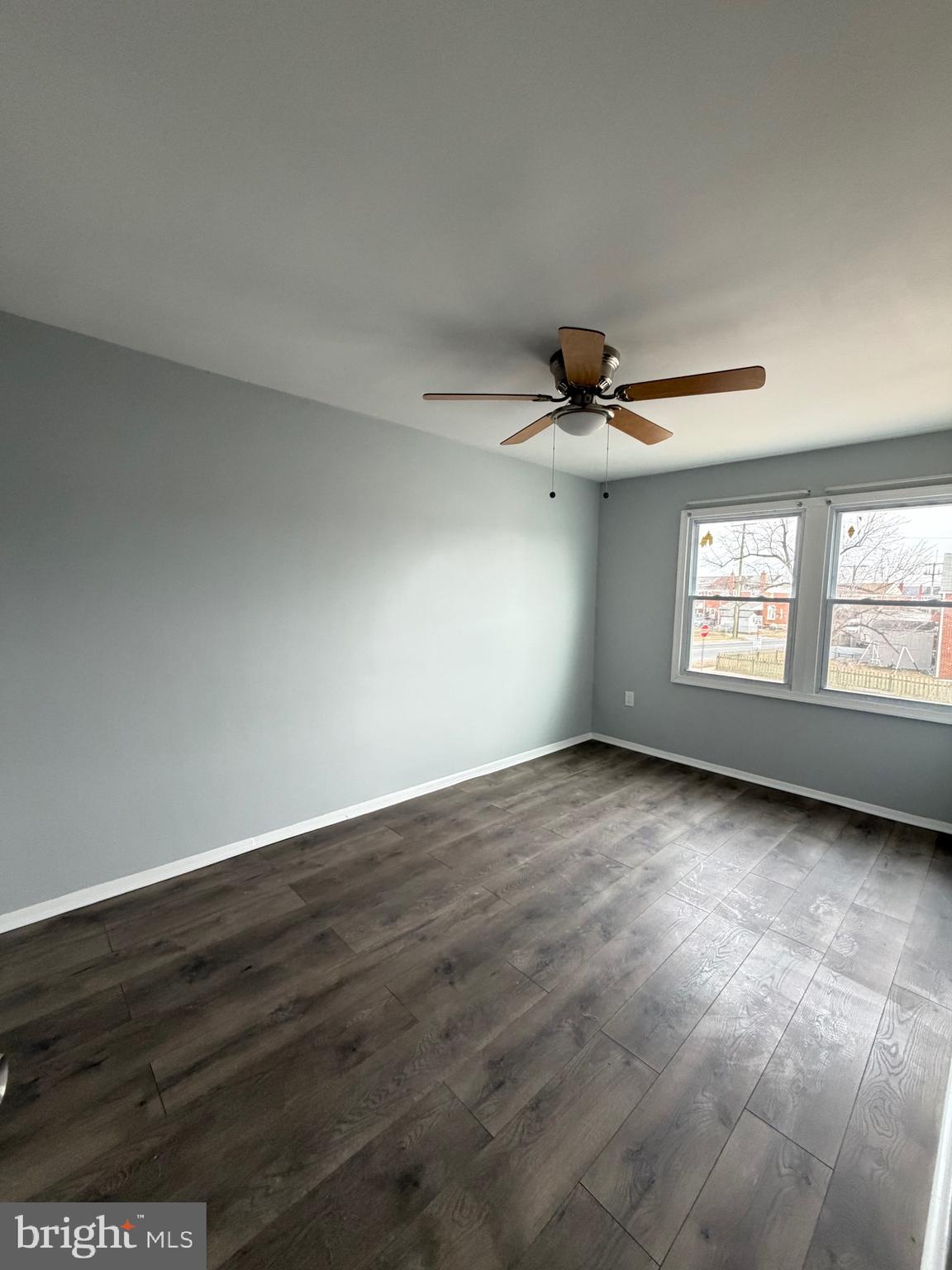 2004 Kelmore Road Baltimore, MD 21222 - Photo 22 of 39 wooden floor in an empty room with a window