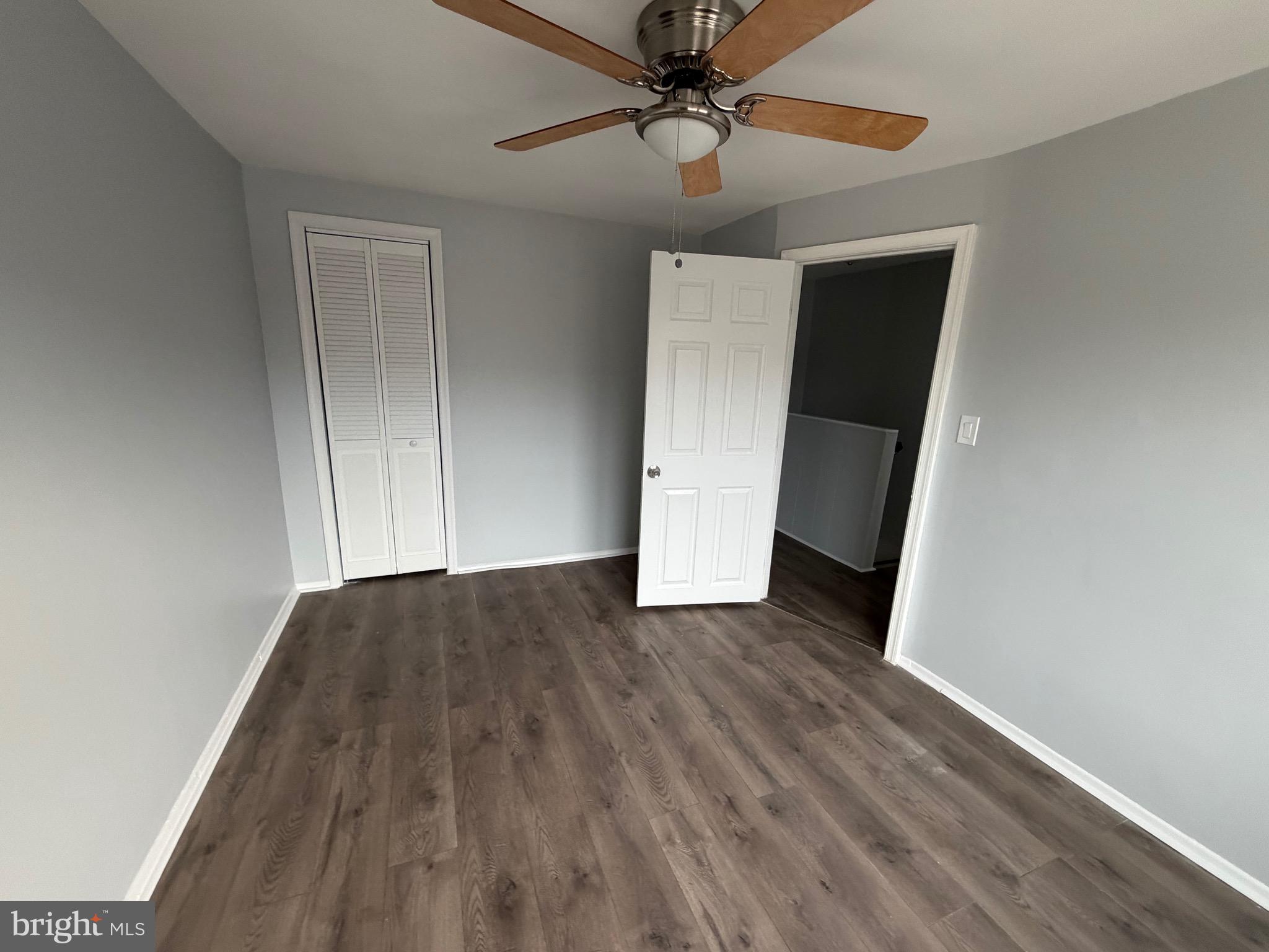 2004 Kelmore Road Baltimore, MD 21222 - Photo 24 of 39 wooden floor in an empty room with a window