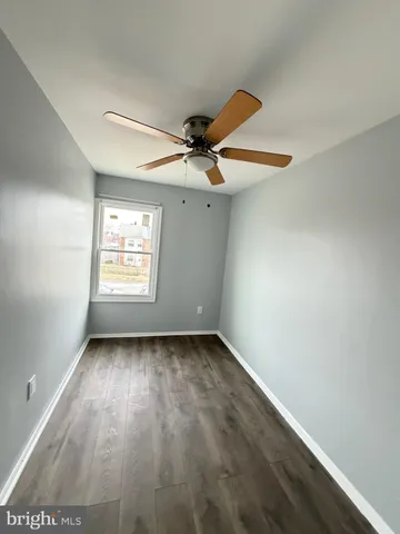 a bathroom with a toilet and a bathtub