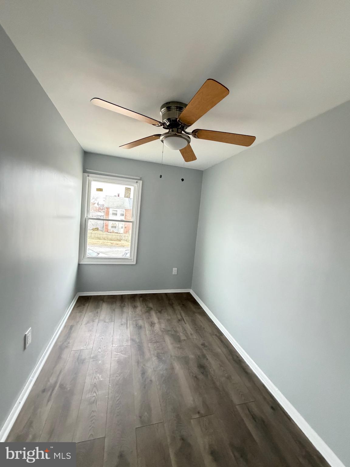 2004 Kelmore Road Baltimore, MD 21222 - Photo 25 of 39 an empty room with windows and fan