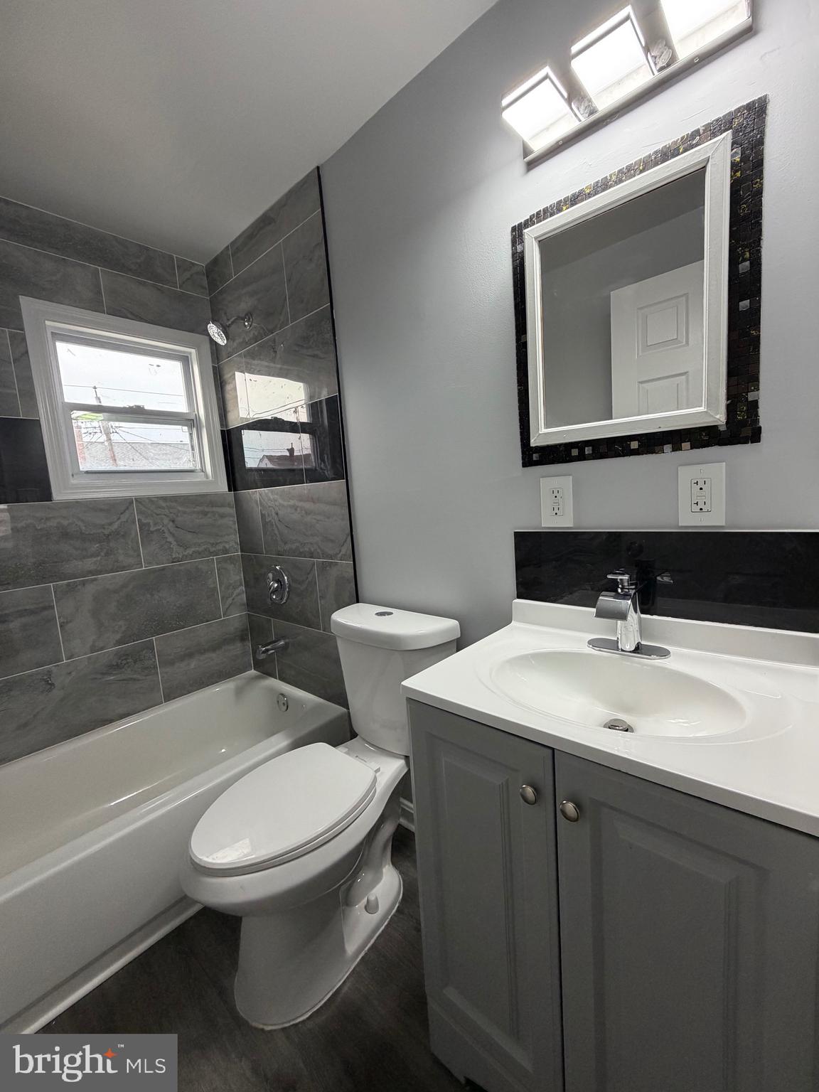 2004 Kelmore Road Baltimore, MD 21222 - Photo 28 of 39 a bathroom with a toilet a sink and bathtub