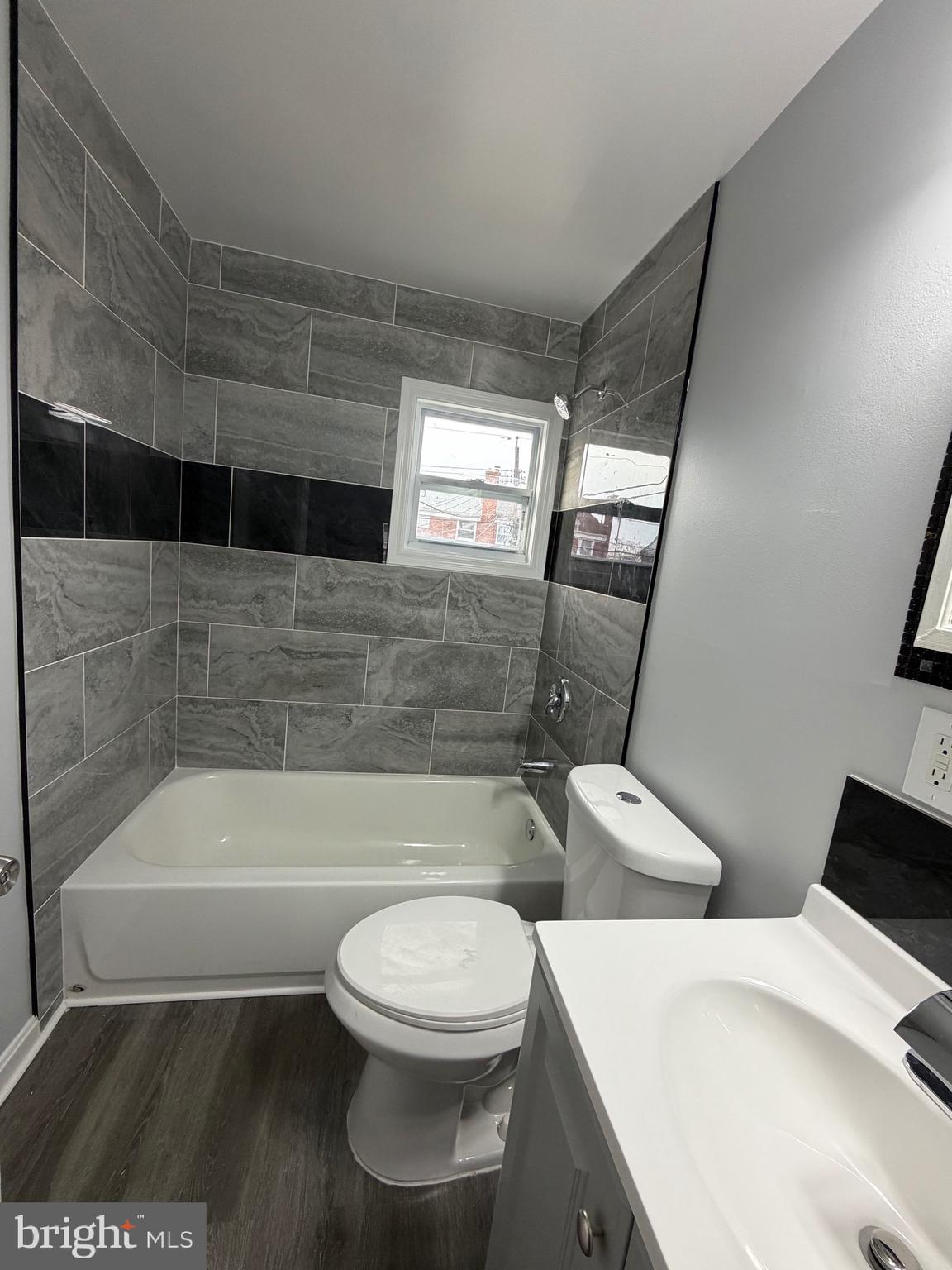 2004 Kelmore Road Baltimore, MD 21222 - Photo 30 of 39 a bathroom with a toilet a bath tub and a shower