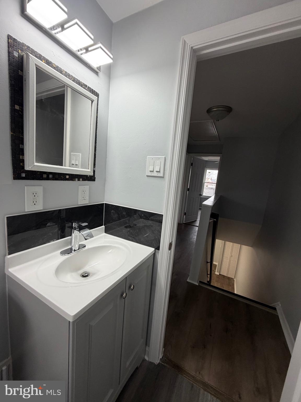 2004 Kelmore Road Baltimore, MD 21222 - Photo 31 of 39 a bathroom with a sink and a mirror