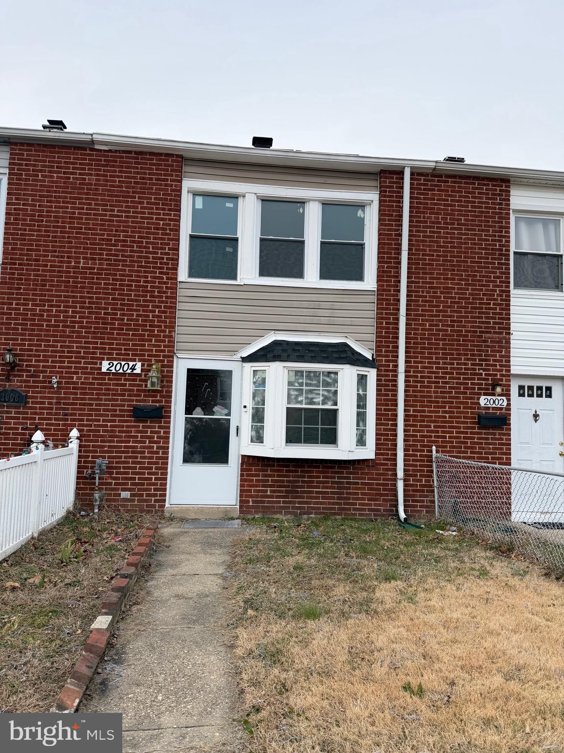2004 Kelmore Road Baltimore, MD 21222 - Photo 34 of 39 a front view of a house with a yard