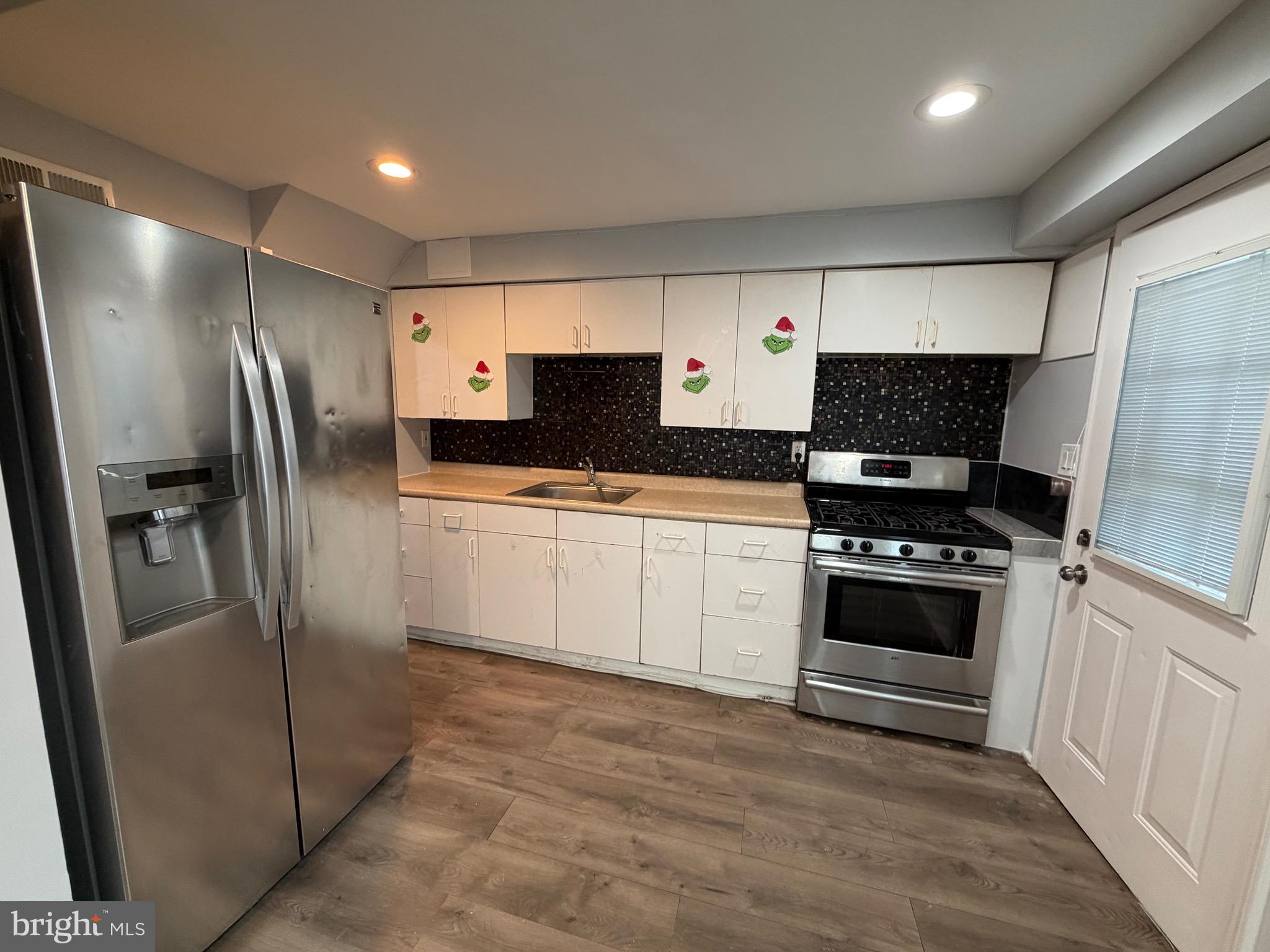 2004 Kelmore Road Baltimore, MD 21222 - Photo 35 of 39 a kitchen with stainless steel appliances a refrigerator sink and stove