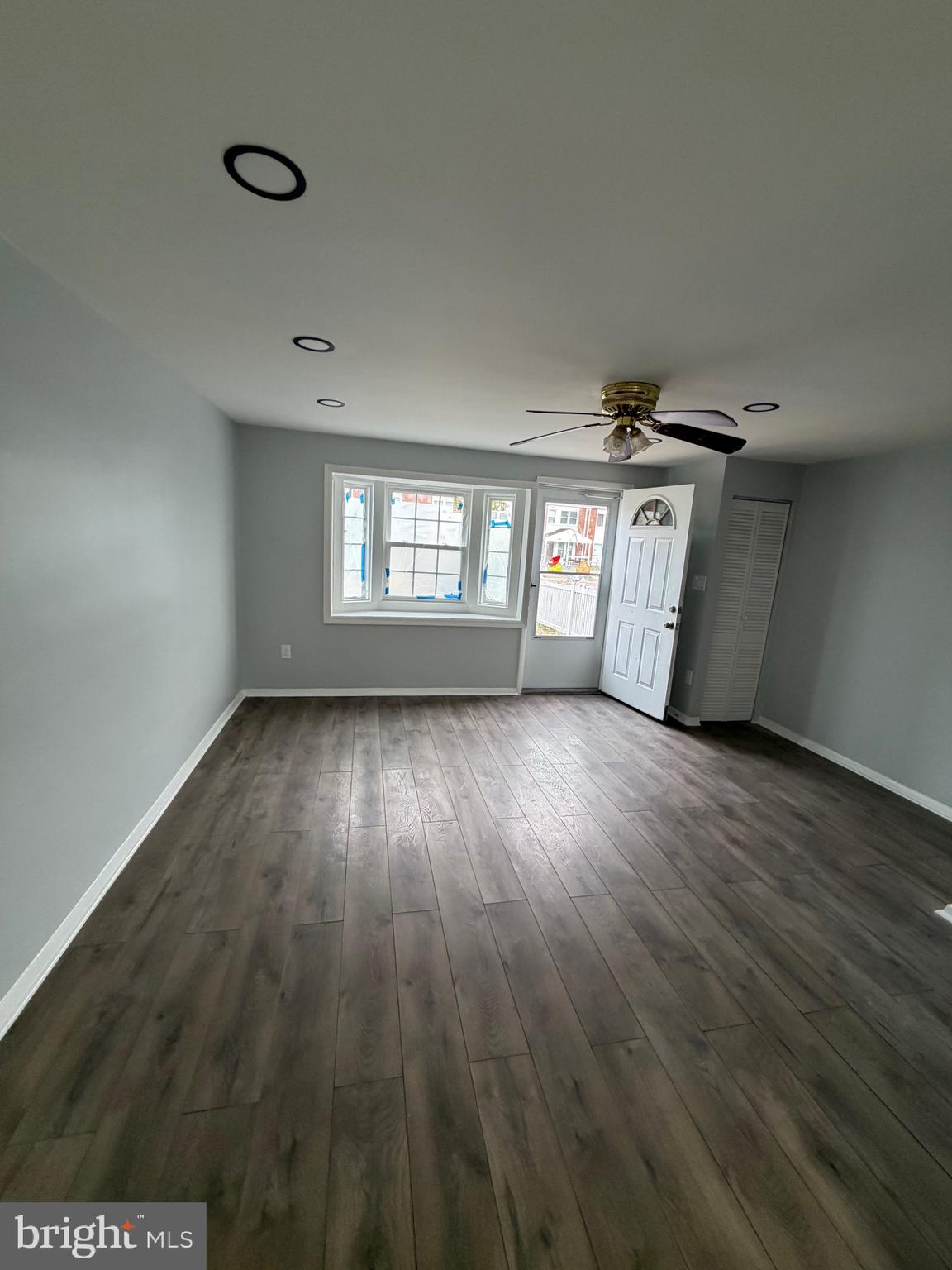 2004 Kelmore Road Baltimore, MD 21222 - Photo 38 of 39 wooden floor in an empty room with a window