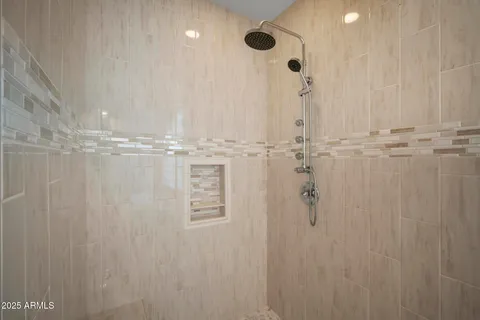 a view of a workspace with furniture and floor to ceiling window