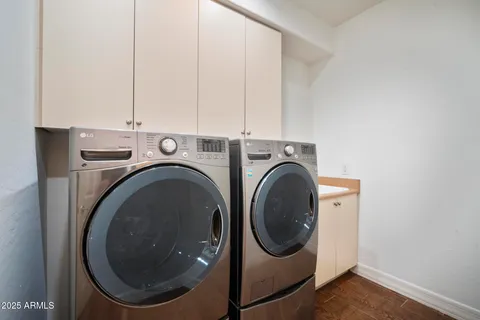 a view of a livingroom with furniture and a painting on the wall
