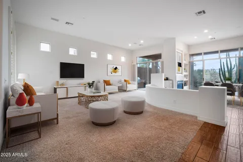 a view of roof deck with table and chairs and potted plants