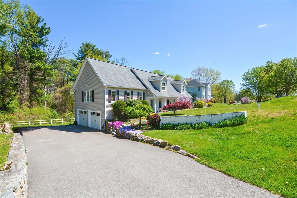 2 Butler Road Mendon, MA 01756 - Photo 2 of 41 a front view of house with yard and outdoor seating