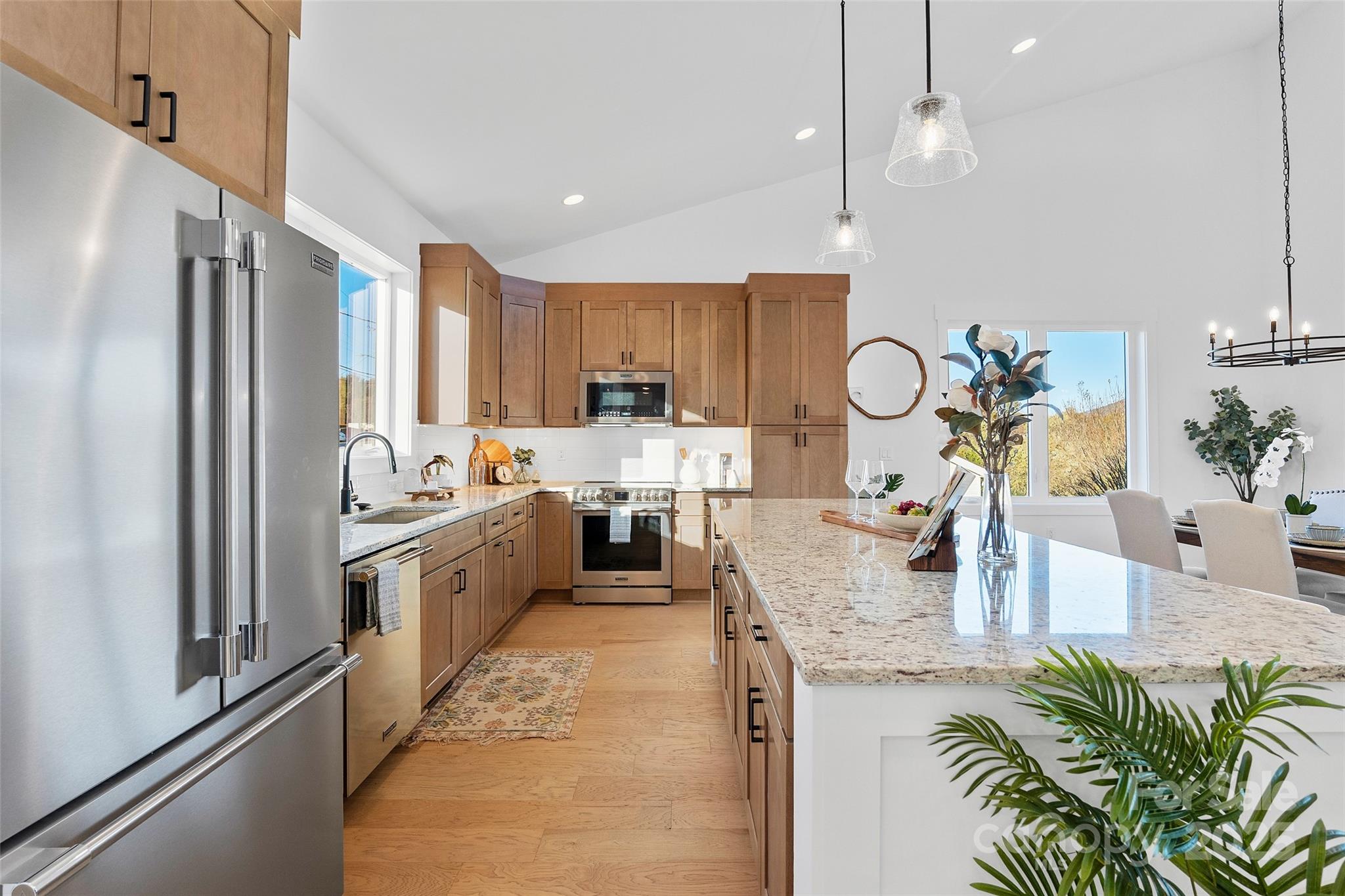 872 Newfound Road Canton, NC 28716 - Photo 11 of 44 a kitchen with sink refrigerator and microwave