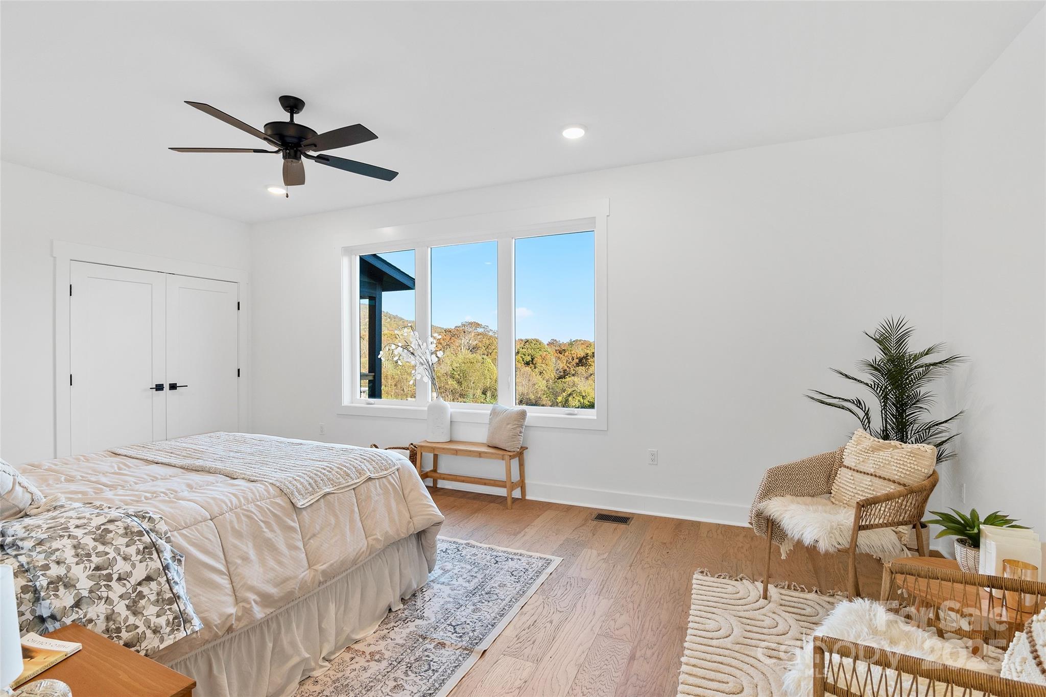 872 Newfound Road Canton, NC 28716 - Photo 21 of 44 a bedroom with a bed and balcony