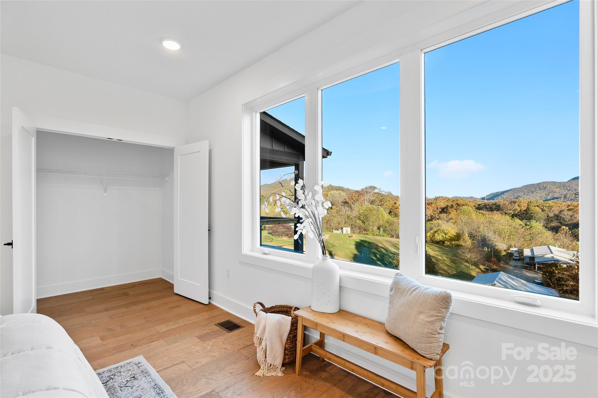 872 Newfound Road Canton, NC 28716 - Photo 22 of 44 a bedroom with furniture and a window