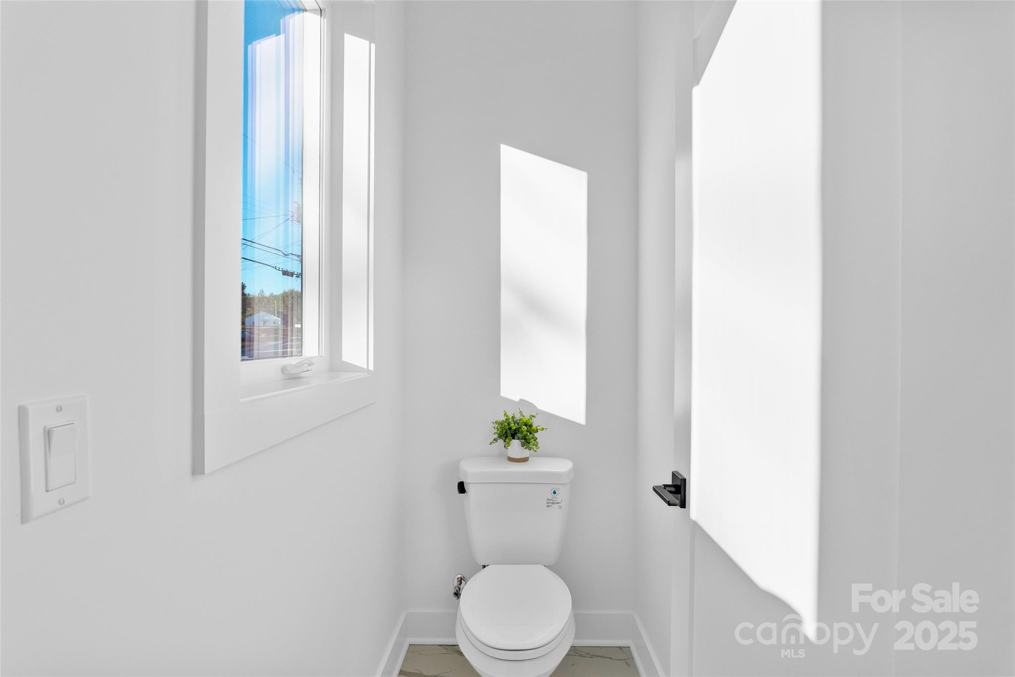 872 Newfound Road Canton, NC 28716 - Photo 27 of 44 a white toilet sitting next to a bathroom sink