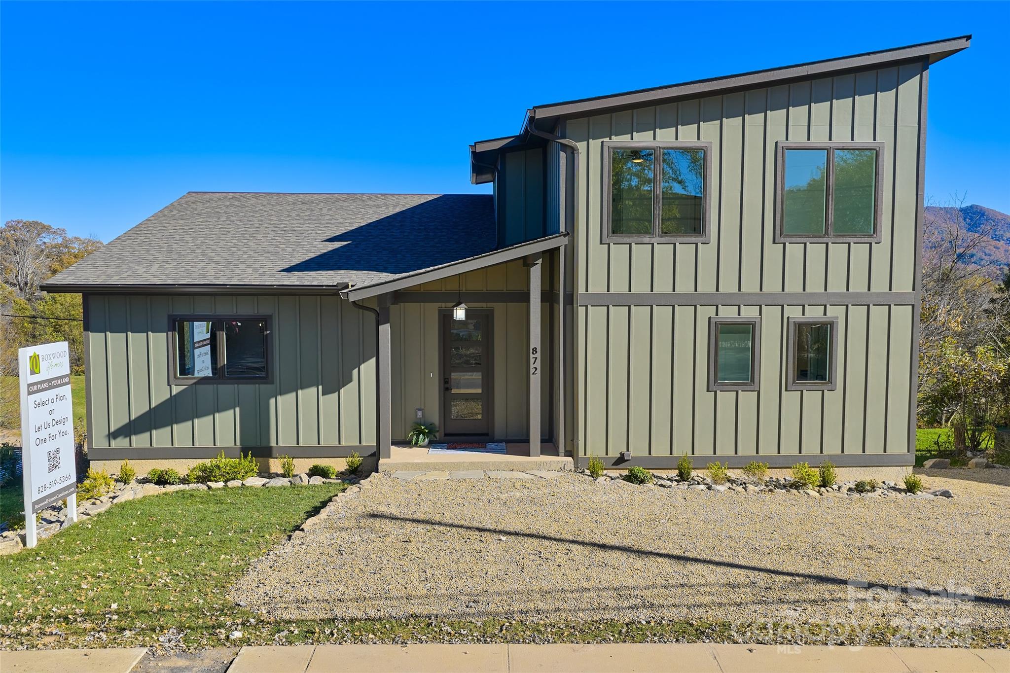 872 Newfound Road Canton, NC 28716 - Photo 3 of 44 a view of a house with a small yard and wooden fence