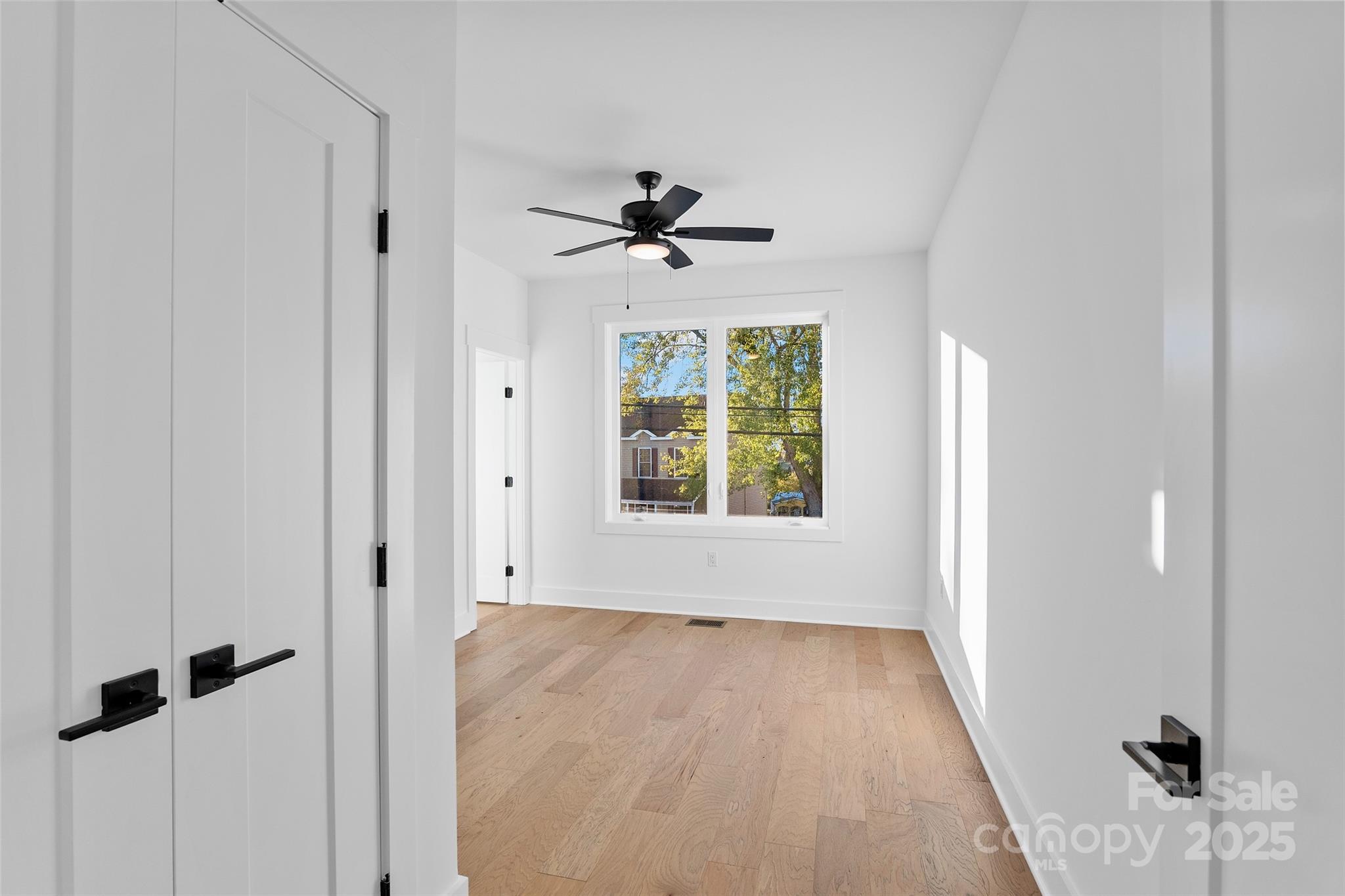 872 Newfound Road Canton, NC 28716 - Photo 34 of 44 wooden floor in an empty room with a window