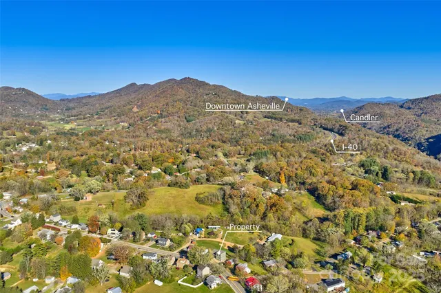 a view of a large mountain with mountains in the background