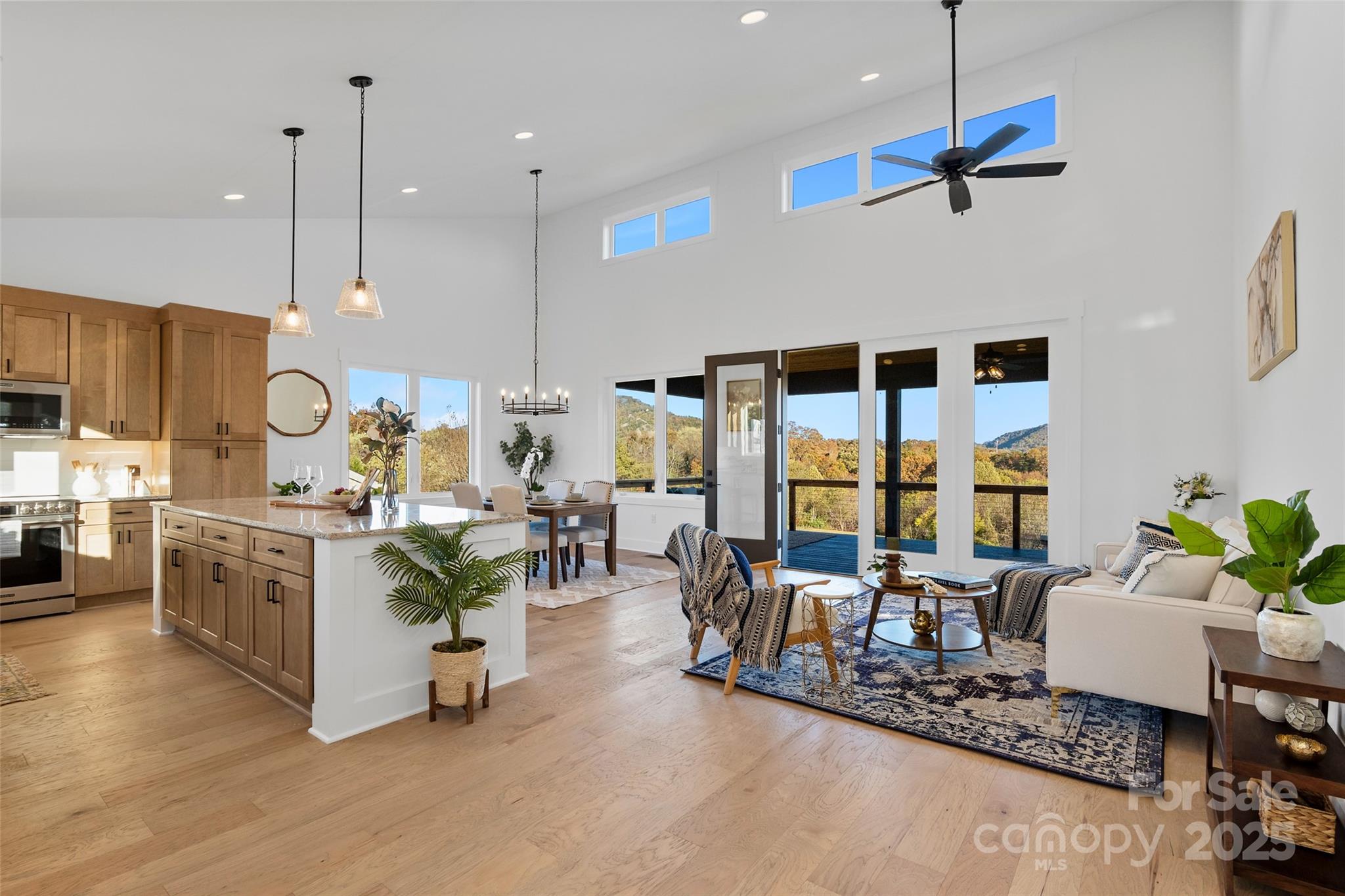 872 Newfound Road Canton, NC 28716 - Photo 5 of 44 a living room with furniture kitchen view and a large window
