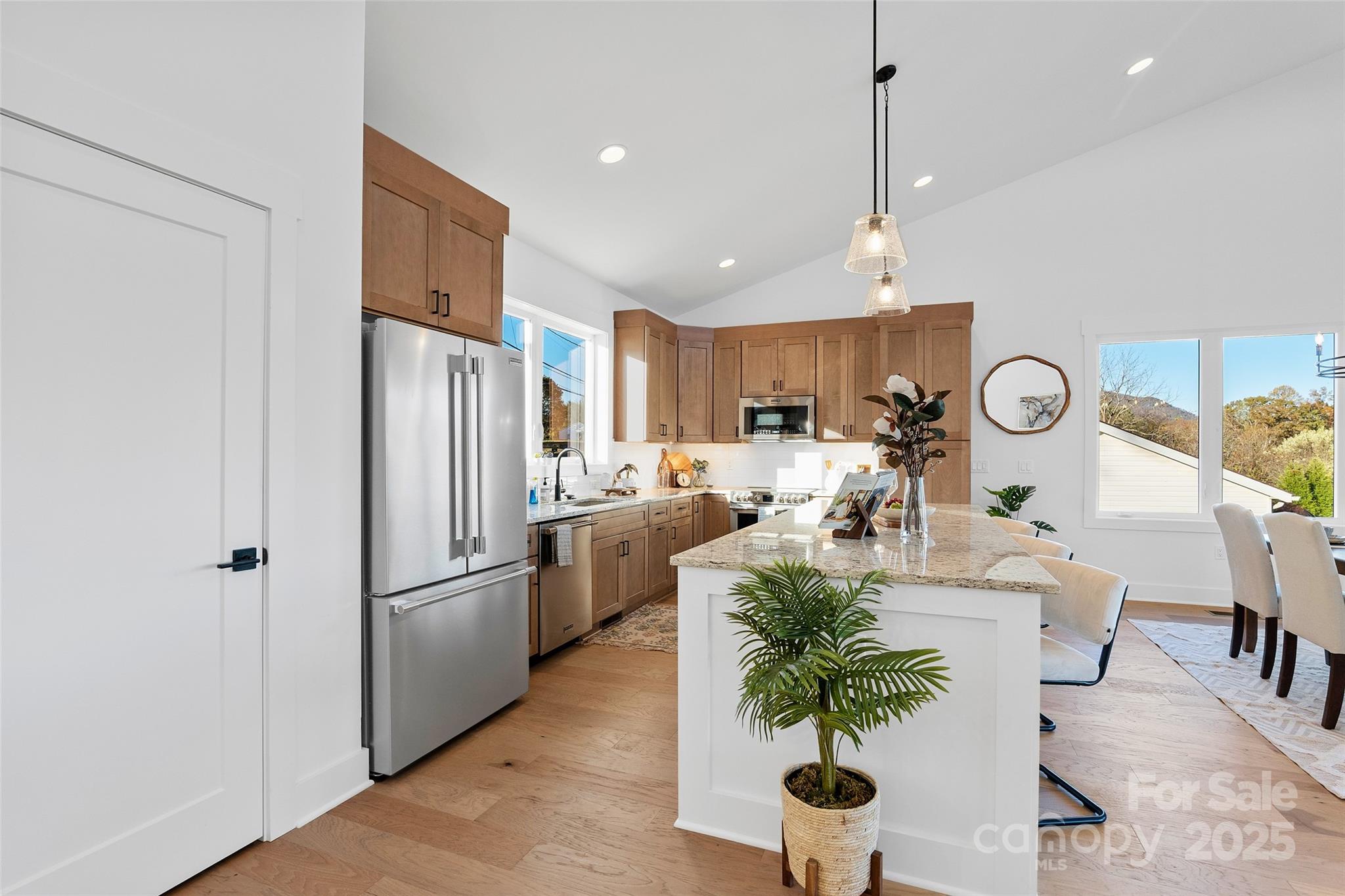 872 Newfound Road Canton, NC 28716 - Photo 10 of 44 a living room with stainless steel appliances furniture a refrigerator a kitchen and a chandelier