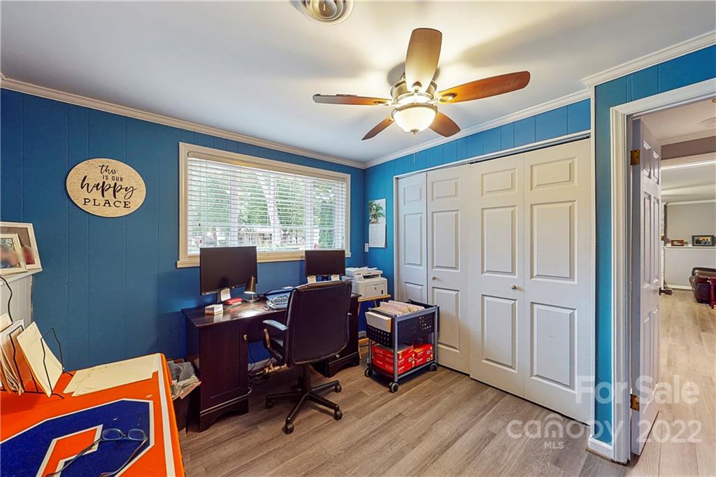 12118 Mapleton Road Charlotte, NC 28273 - Photo 27 of 48 a view of a workspace with furniture and a window