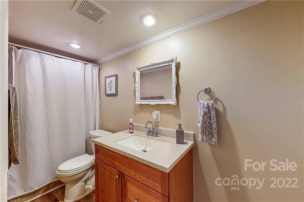 12118 Mapleton Road Charlotte, NC 28273 - Photo 31 of 48 a bathroom with a sink toilet and shower