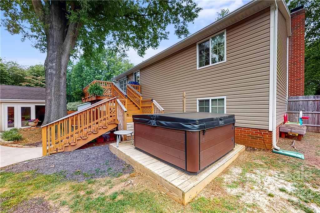 12118 Mapleton Road Charlotte, NC 28273 - Photo 36 of 48 a view of a house with wooden deck and a trees