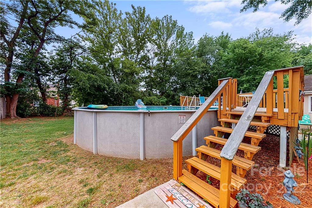 12118 Mapleton Road Charlotte, NC 28273 - Photo 37 of 48 a view of deck with two chair and table