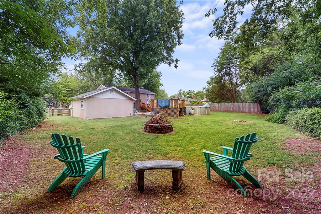 12118 Mapleton Road Charlotte, NC 28273 - Photo 41 of 48 a backyard of a house with table and chairs