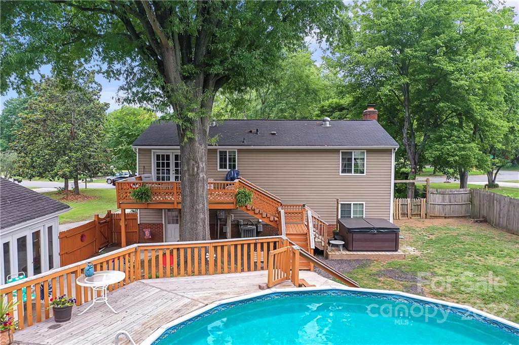 12118 Mapleton Road Charlotte, NC 28273 - Photo 48 of 48 a view of an house with backyard and a slide