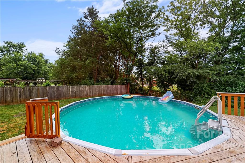 12118 Mapleton Road Charlotte, NC 28273 - Photo 5 of 48 a view of a swimming pool with a patio