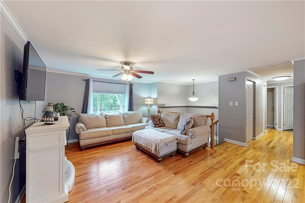 12118 Mapleton Road Charlotte, NC 28273 - Photo 6 of 48 a living room with furniture and a large window
