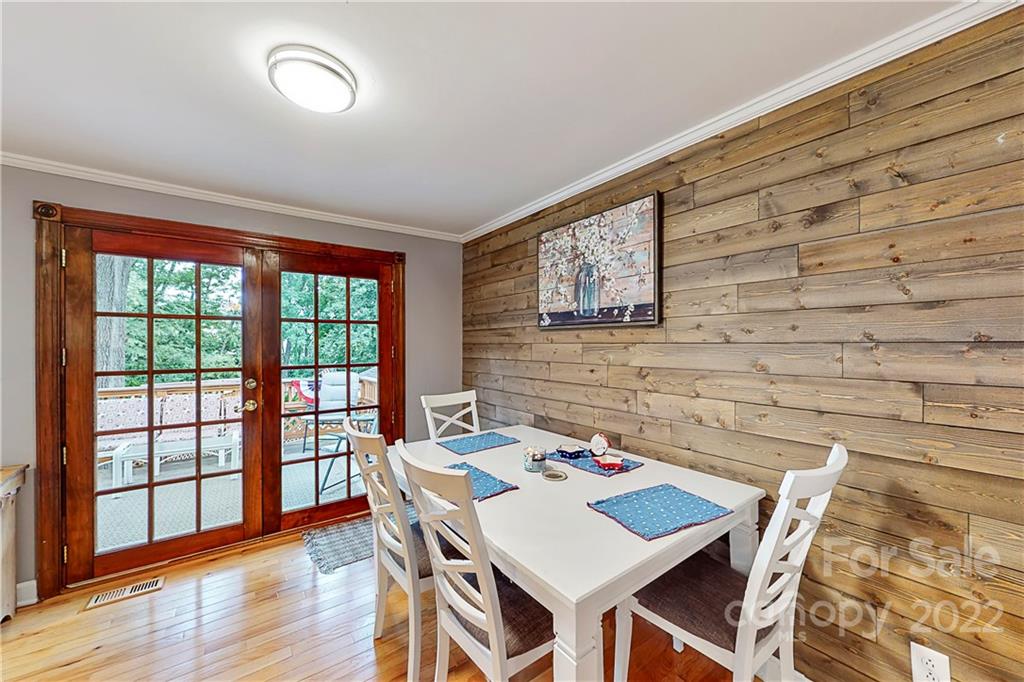 12118 Mapleton Road Charlotte, NC 28273 - Photo 10 of 48 a view of a dining room with furniture window and wooden floor