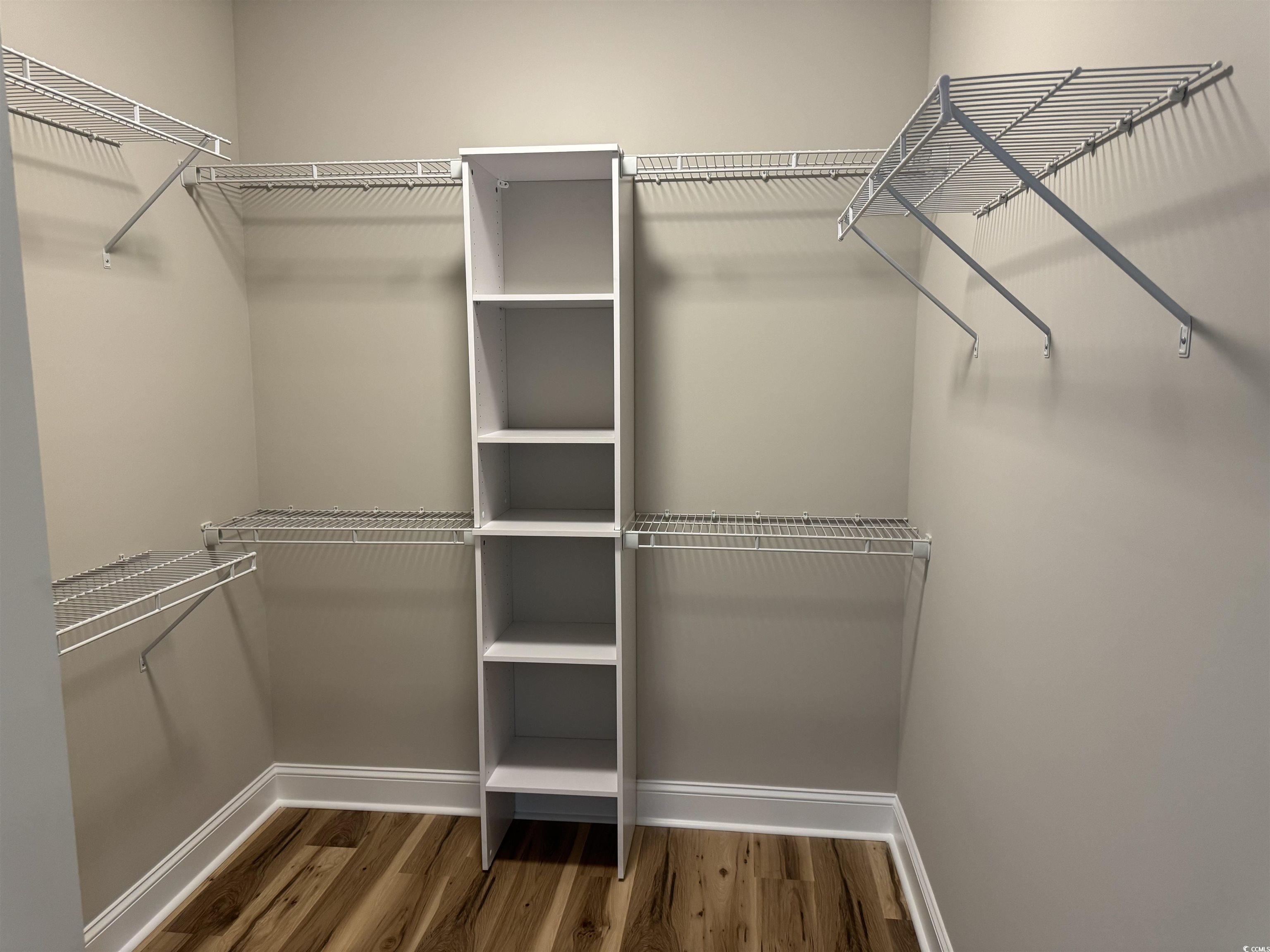 4963 Dupont Road Aynor, SC 29511 - Photo 9 of 18 Walk in closet with dark wood finished floors