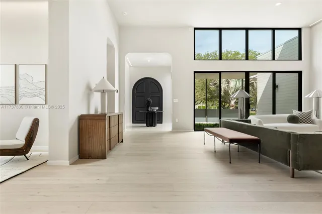 a view of a livingroom with furniture and large window