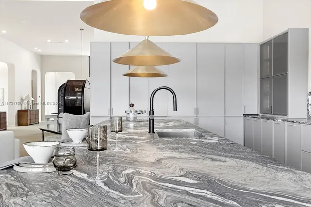 a kitchen with sink and refrigerator